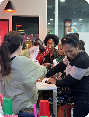 Group of customers enjoying milkshakes at a table